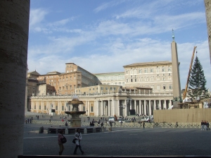 Piazza San Pietro, with the obelisk and Bernini's fountain. A relic of the True Cross is in the cross at the top of the obelisk.  You can also see the Apostolic Palace.